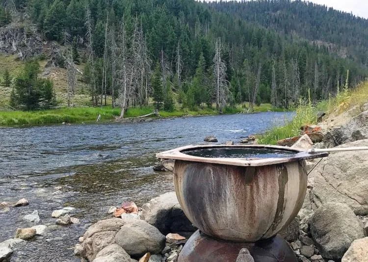Boat Box Hot Springs unique rock formation soaking pool with Sawtooth Mountain views near Stanley Idaho